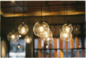 Aesthetic indoor lighting with transparent globe pendant lamps creating a warm ambiance.